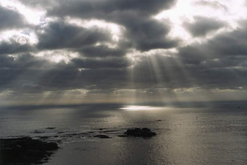 sunbeams and clouds over sea from Clifton