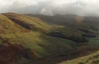 sunlit hillside and valley in shadow