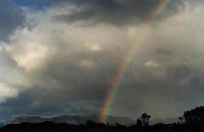 rainbow against cumulus above Muizenberg Mountain