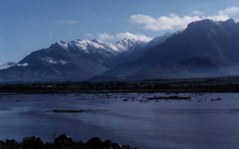 snowy peaks behind Berg river in flood