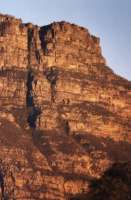extreme close-up of sunrise on Table Mountain from Southern Suburbs
