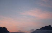pale sunset on cirrus over mountain