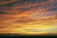 Sunrise on cirrus over mountains and Cape Flats