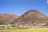 Burned Muizenberg Peak from estuary-mouth