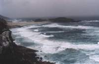Robberg Peninsula with stormy waves and Island