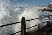 wave splash over promenade at Green Point