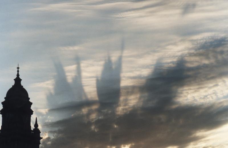 City Hall and towering shadows of clouds