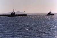 harbour and breakwater with tugs