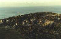 rocky hillside and sea