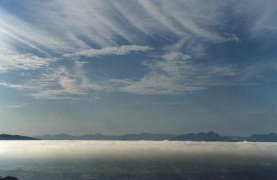 Fog over suburbs and cirrus over mountains from Rhodes Memorial