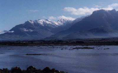 snowy peaks behind Berg river in flood