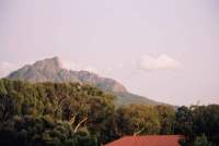 pre-dawn flames flickering on the upper slopes of Devil's Peak