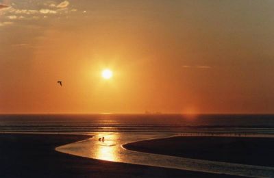 sunset over river and sea